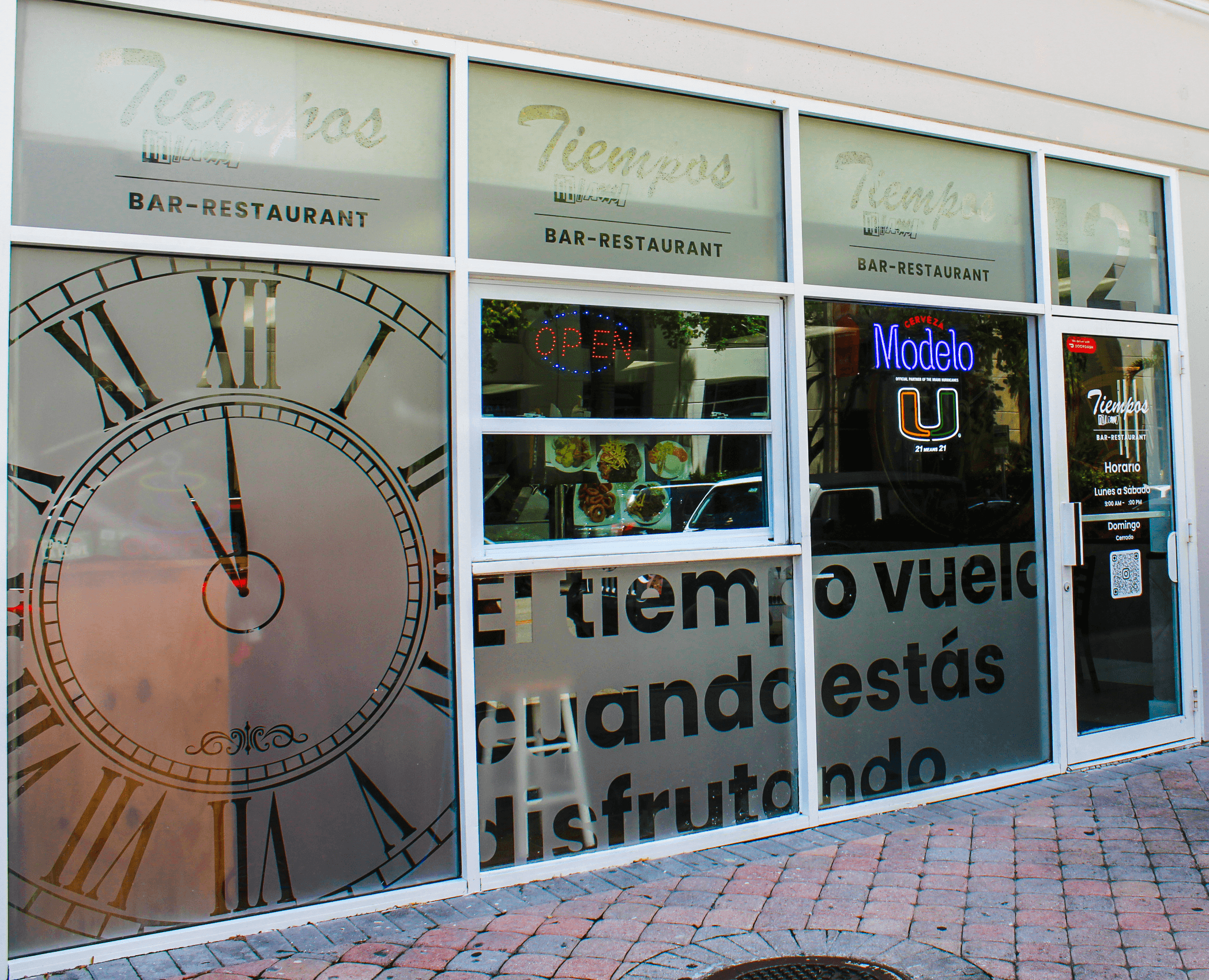 Outdoor patio seating area with tropical plants